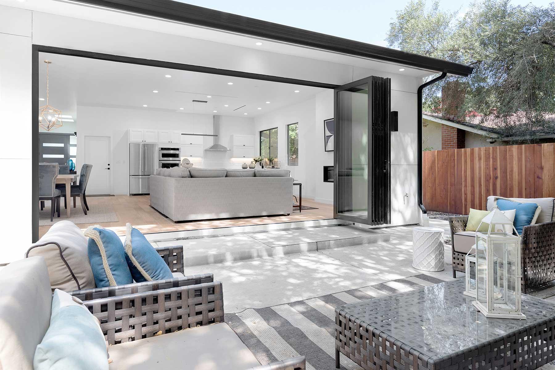 Elegant kitchen with custom white cabinetry, marble countertops, and premium appliances